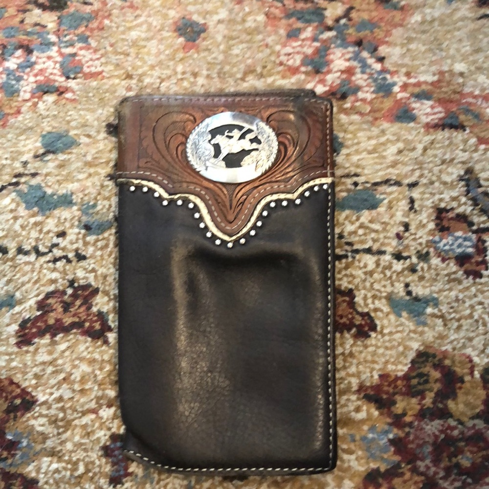 Tooled leather checkbook cover with cowboy vintage
